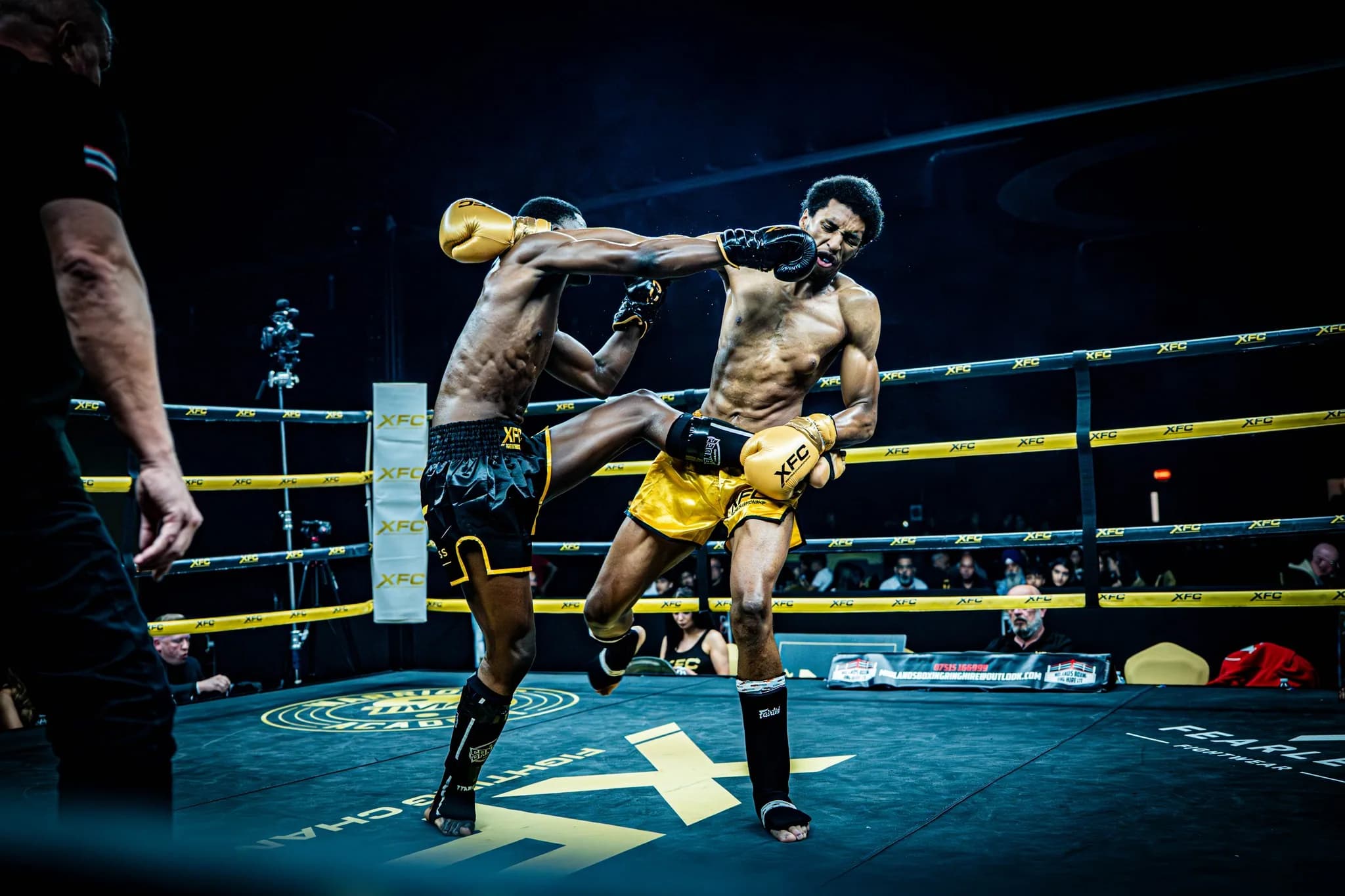 XFC fighter landing a clean cross to the face inside the ring.