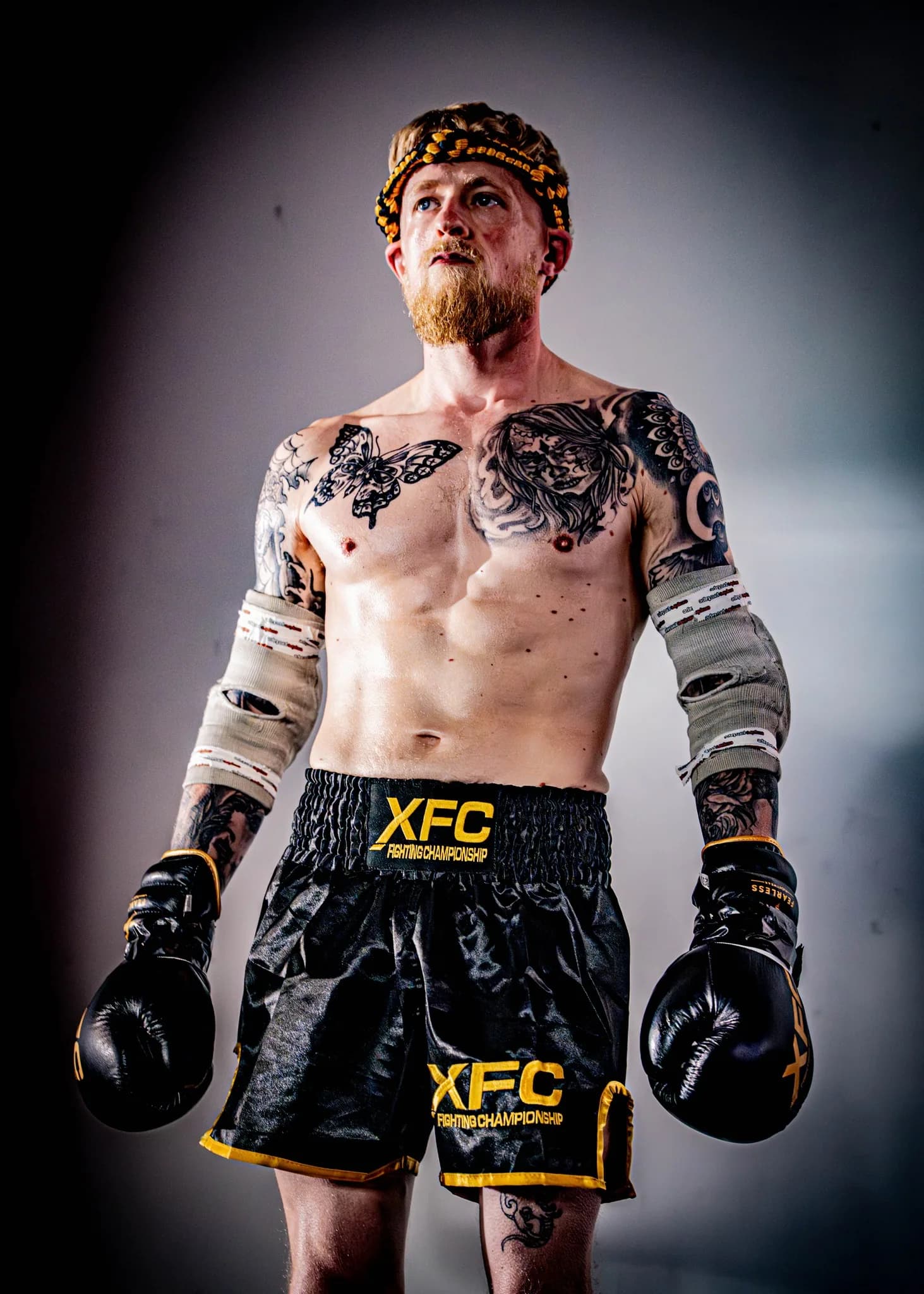XFC fighter portrait under a spotlight before walking out to compete.
