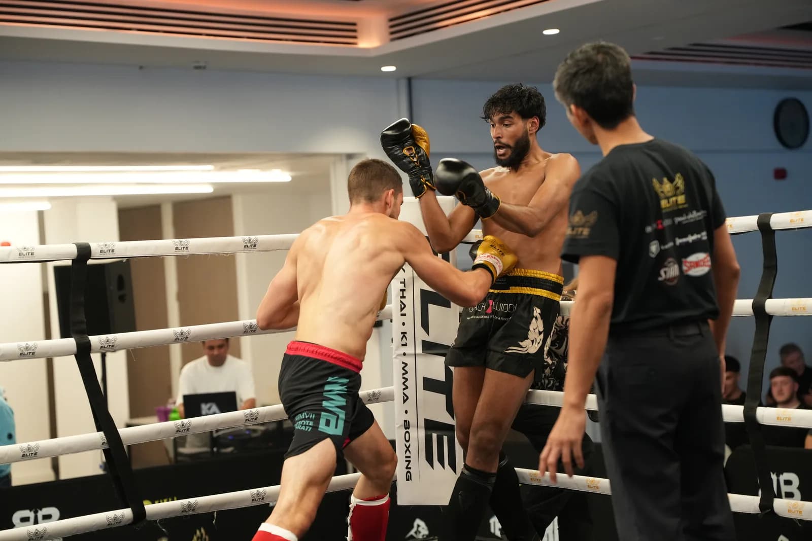 XFC ringside image of a punch landing in front of the corner post.
